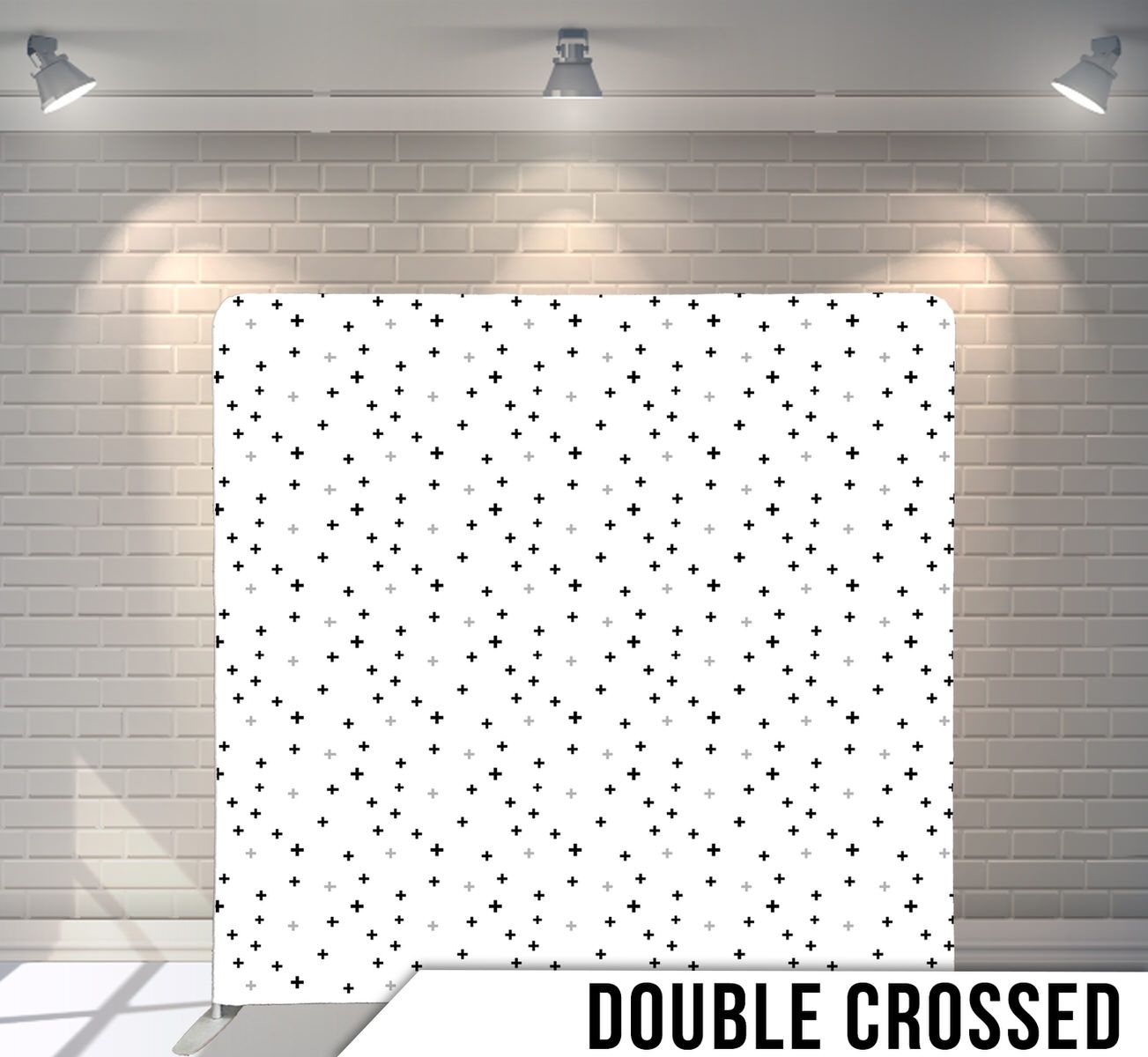 Simple white backdrop with scattered small black polka dots in random pattern.