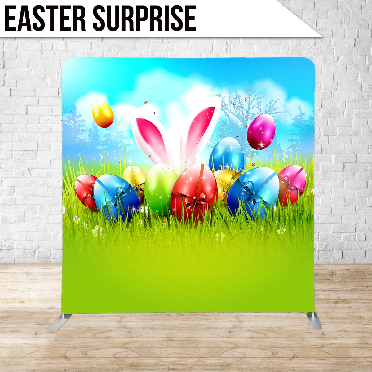 Whimsical Easter backdrop with bunny ears and decorated eggs in spring grass setting.