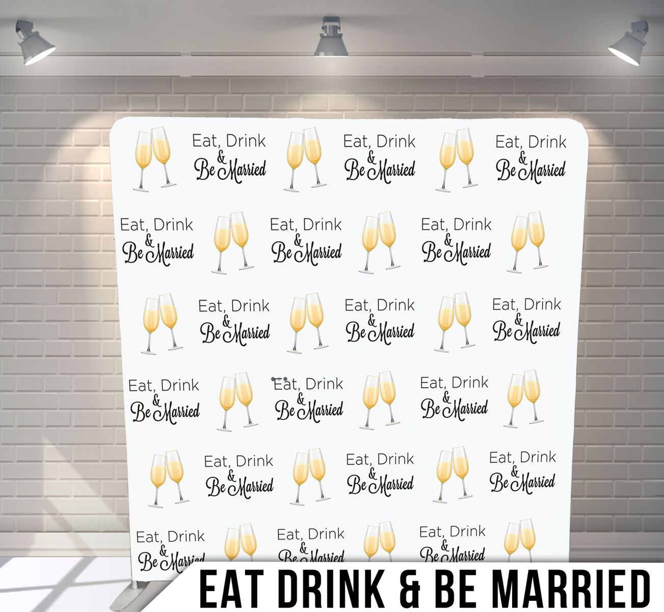White backdrop with repeating champagne glass pattern saying Eat Drink & Be Married.
