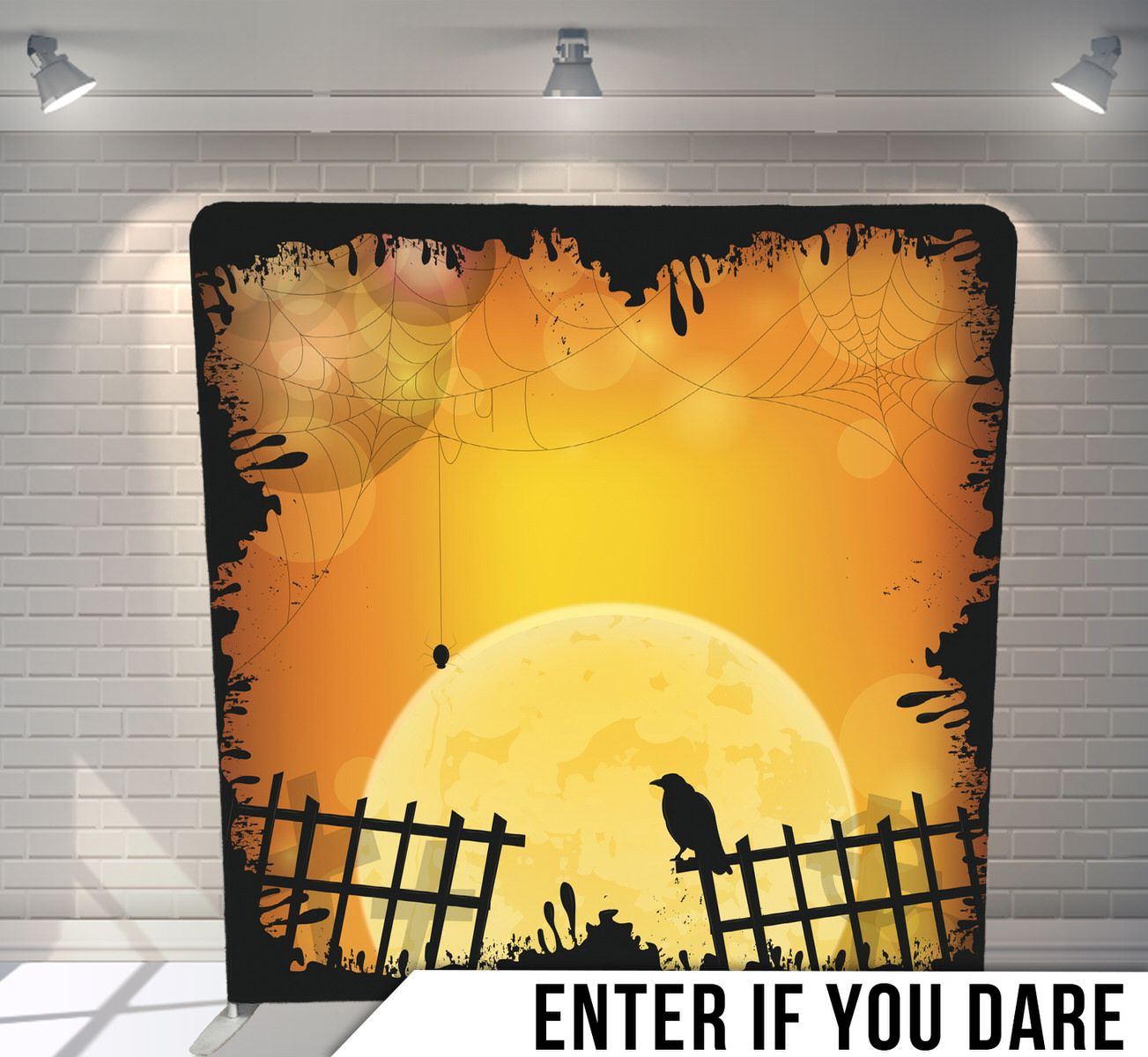Silhouette of a crow on fence against orange sunset with decorative Halloween border.