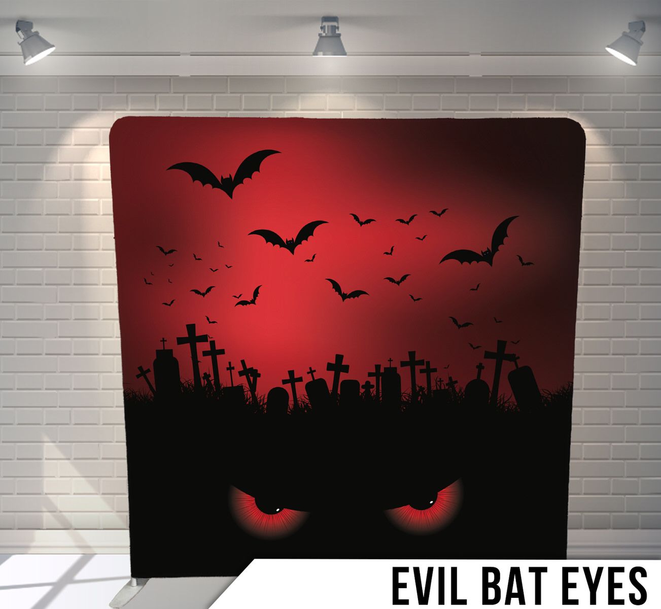 Spooky Halloween backdrop with evil red eyes, flying bats silhouettes and graveyard crosses against a dark red sky.