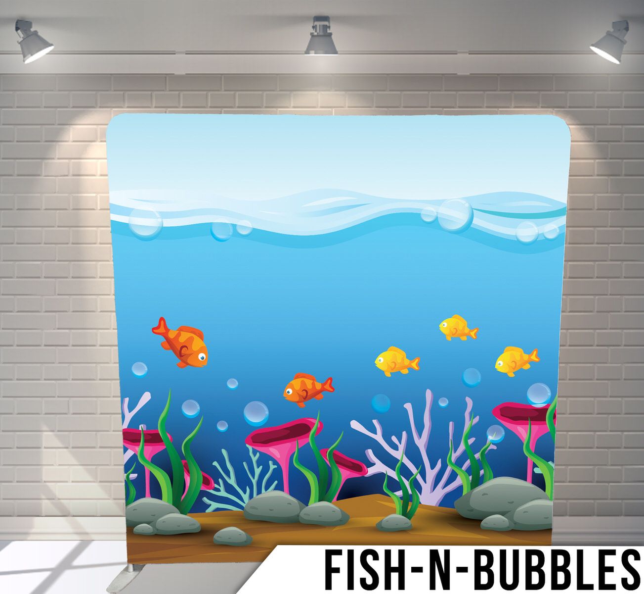 Cartoon underwater scene with colorful fish swimming among coral, seaweed, and bubbles against a blue ocean backdrop.