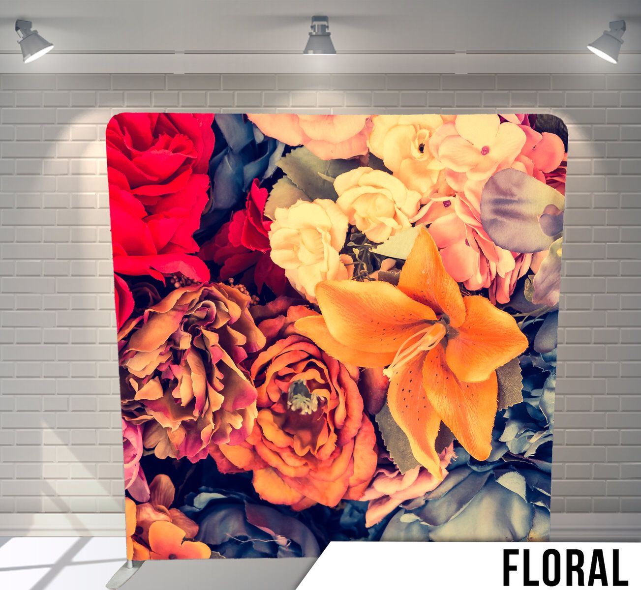 Close-up of vibrant roses and lilies in red, orange, yellow and blue tones.