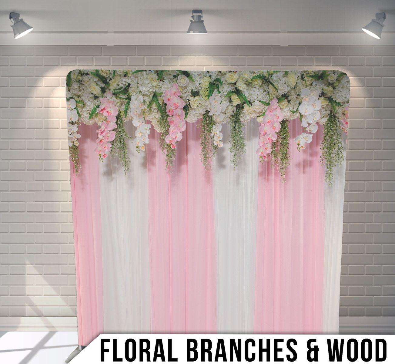 Pink and white striped backdrop with hanging floral branches and greenery creating an elegant party decoration setup.