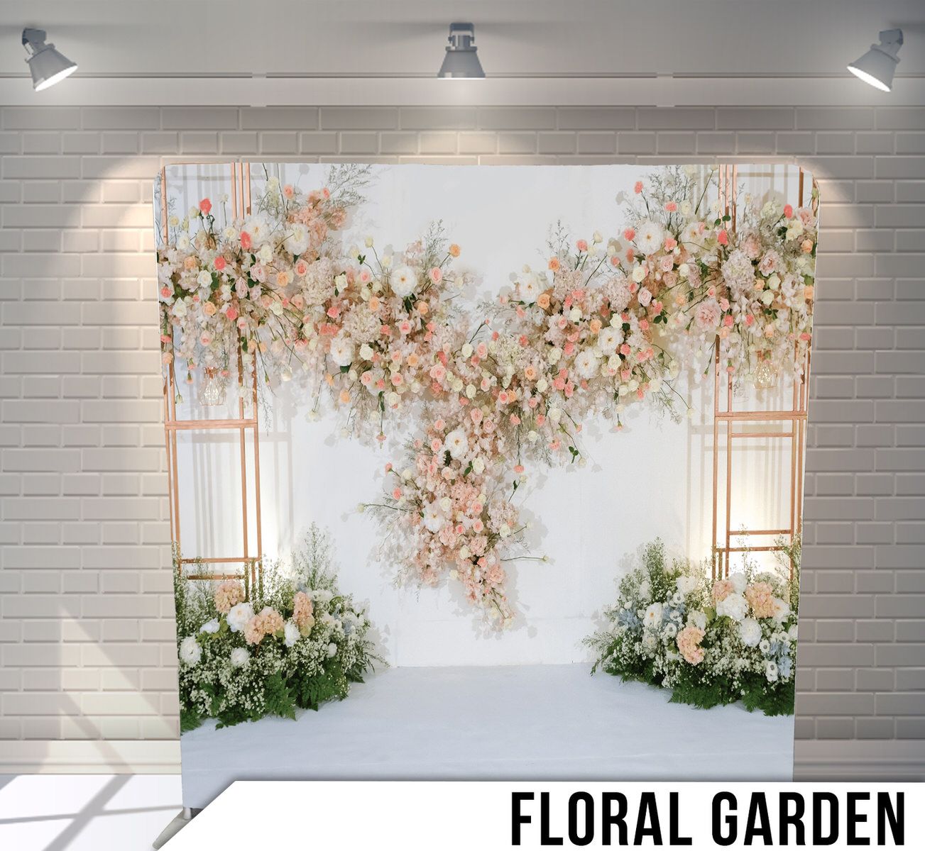 Elegant floral backdrop with pink and white flowers cascading from metal frames against white brick and light spotlights.