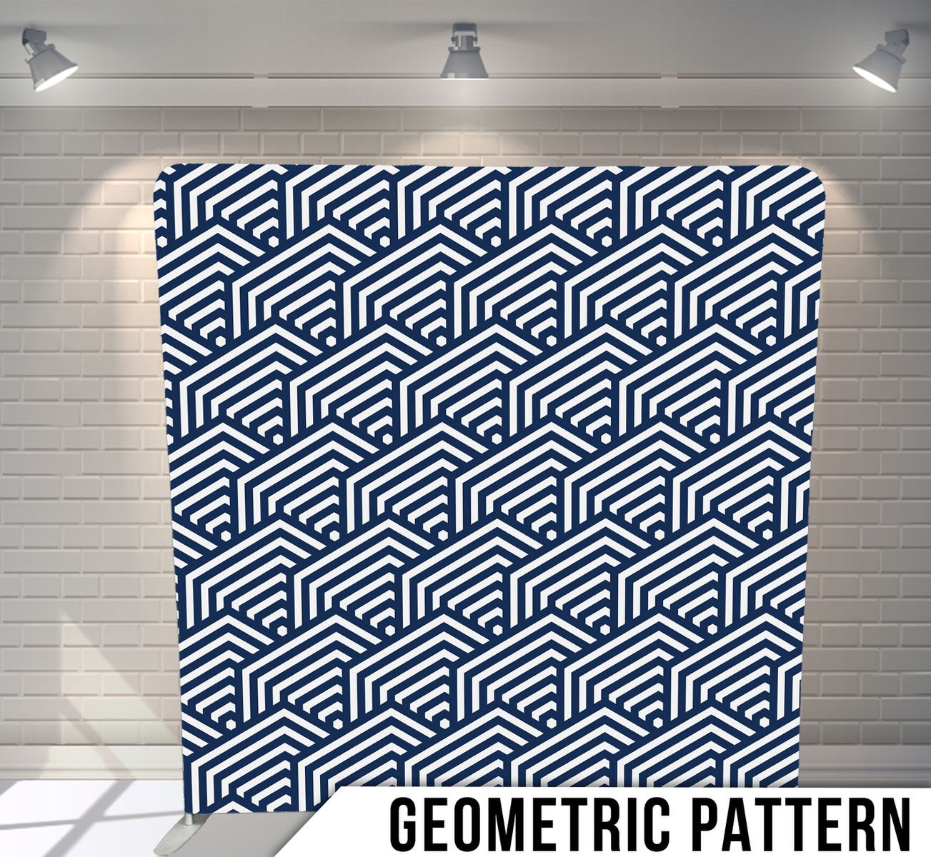 Abstract navy blue geometric pattern with repeating isometric cube shapes displayed against a white brick wall.