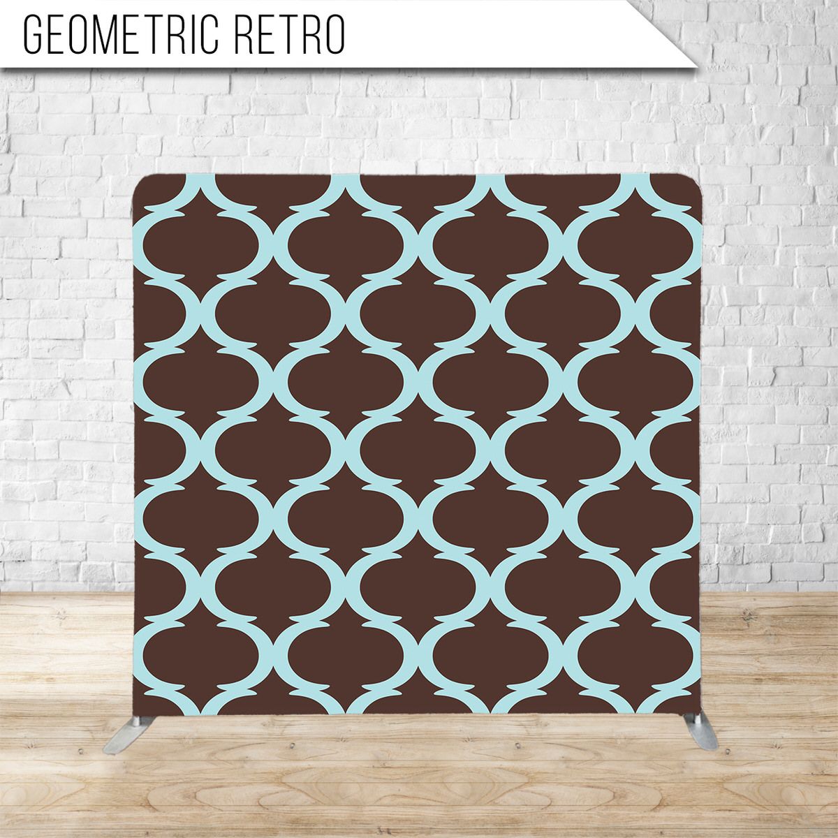 Brown and light blue quatrefoil pattern backdrop displayed against white brick wall.