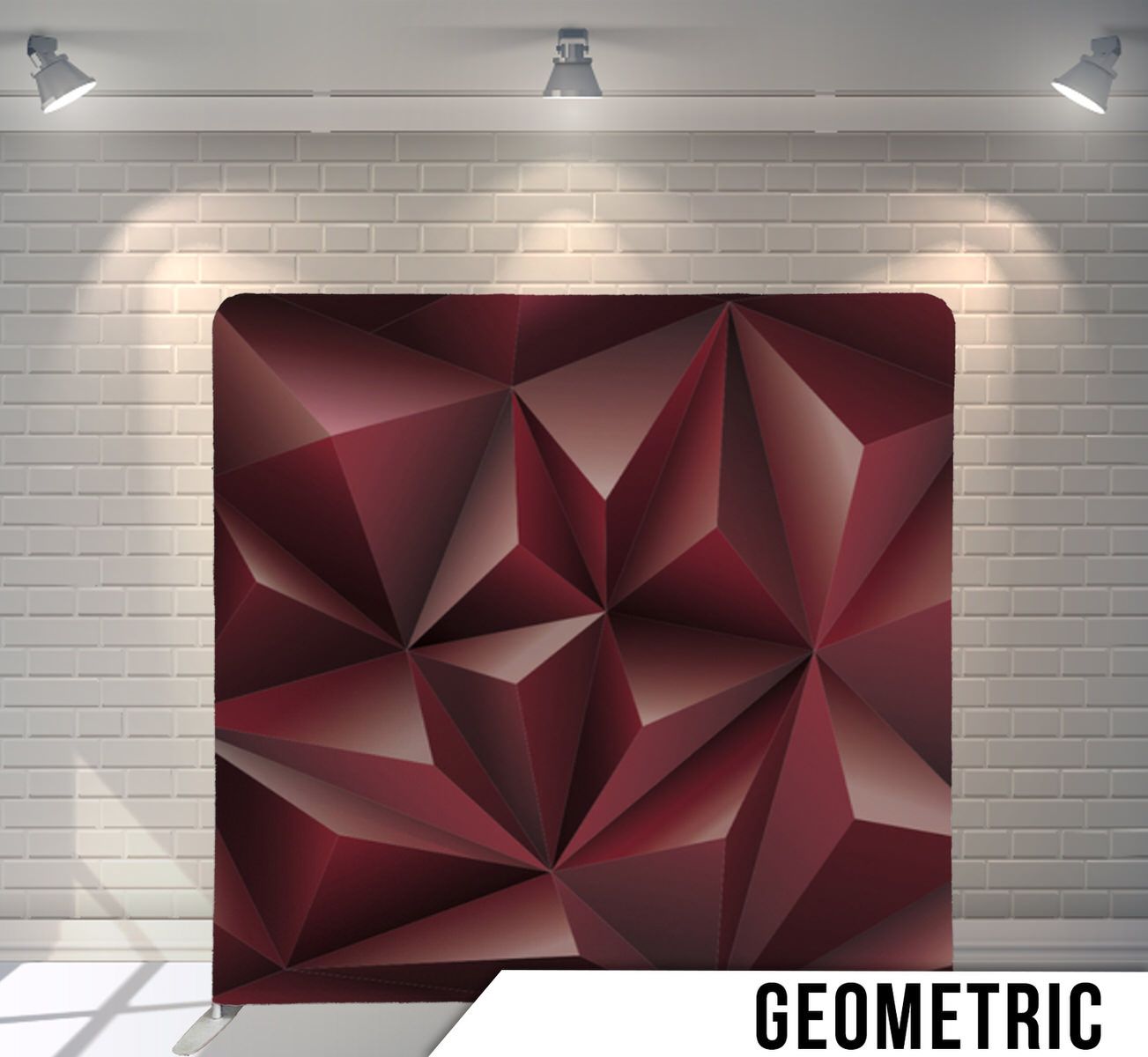 Deep burgundy geometric wall panel with angular 3D diamond patterns and shadows.