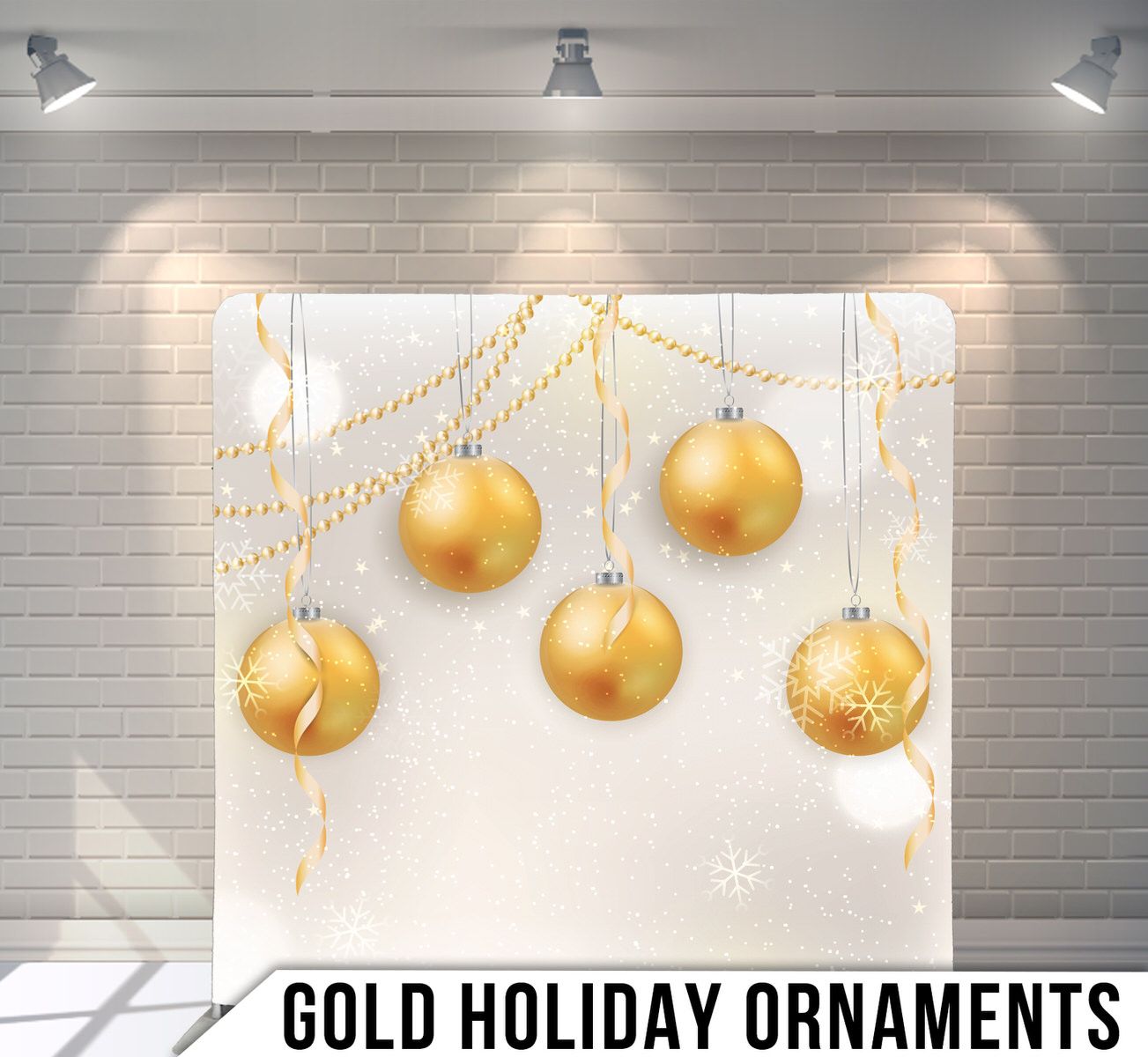 Elegant gold Christmas ornament baubles hanging against a white background.