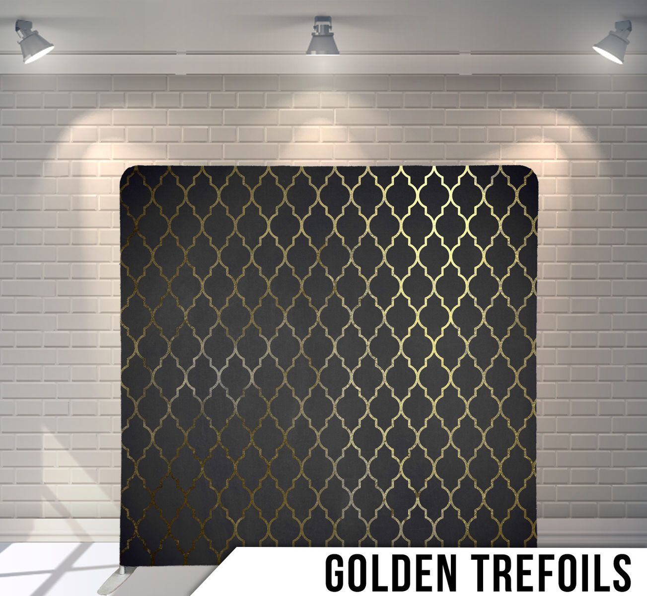 Luxurious golden quatrefoil pattern on dark background creating an elegant geometric design.