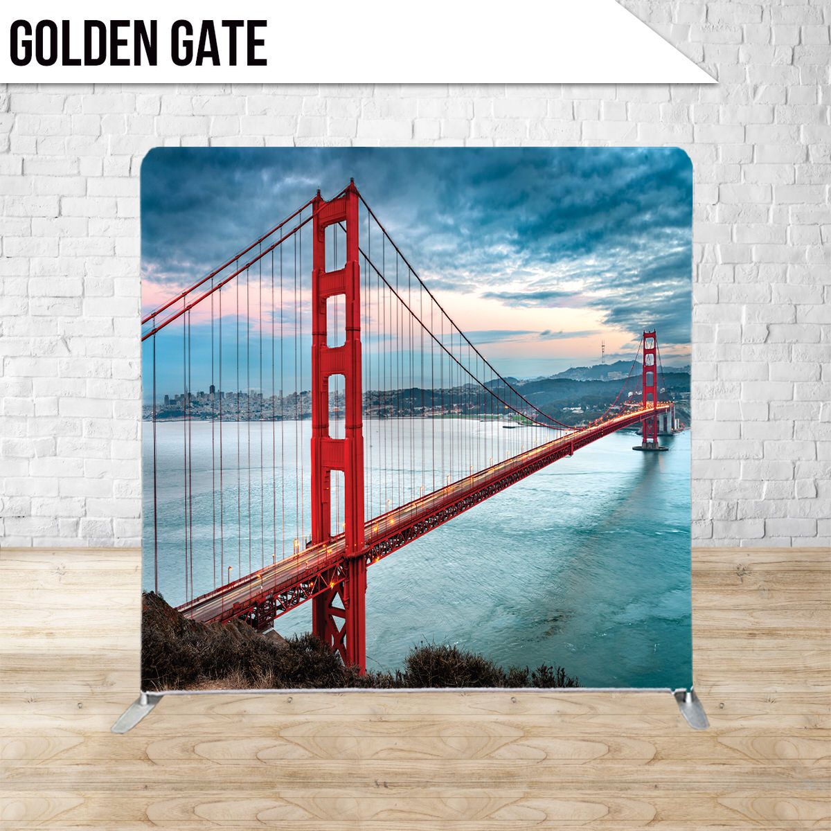 Iconic red Golden Gate Bridge spans across San Francisco Bay with dramatic blue sky and city skyline in background.