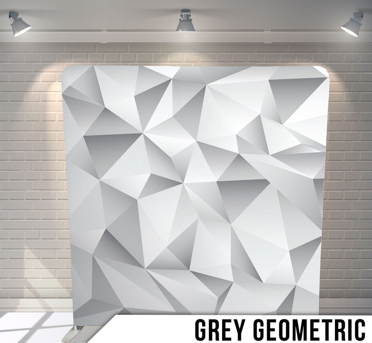 Modern white geometric backdrop with triangular 3D patterns.