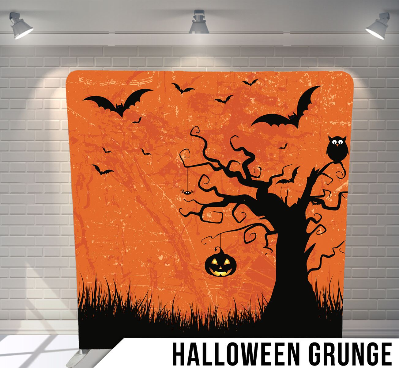 Spooky Halloween silhouette scene with dead tree, bats, and jack-o-lantern against orange sky.