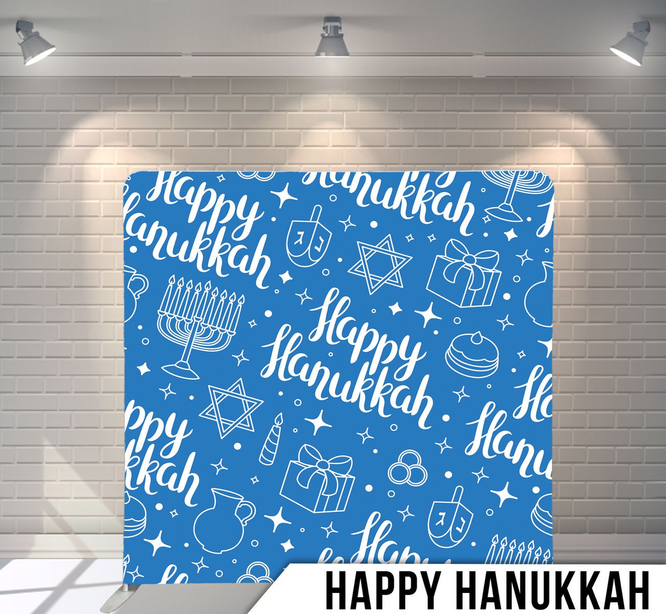 Blue Hanukkah pattern background with white dreidels, menorahs and Happy Hanukkah text.