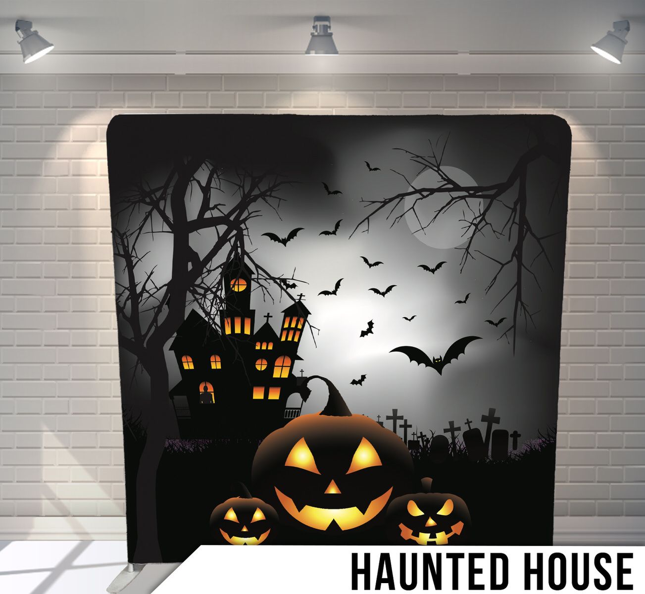 Halloween scene with glowing jack-o-lanterns in front of a haunted mansion silhouette against a full moon.