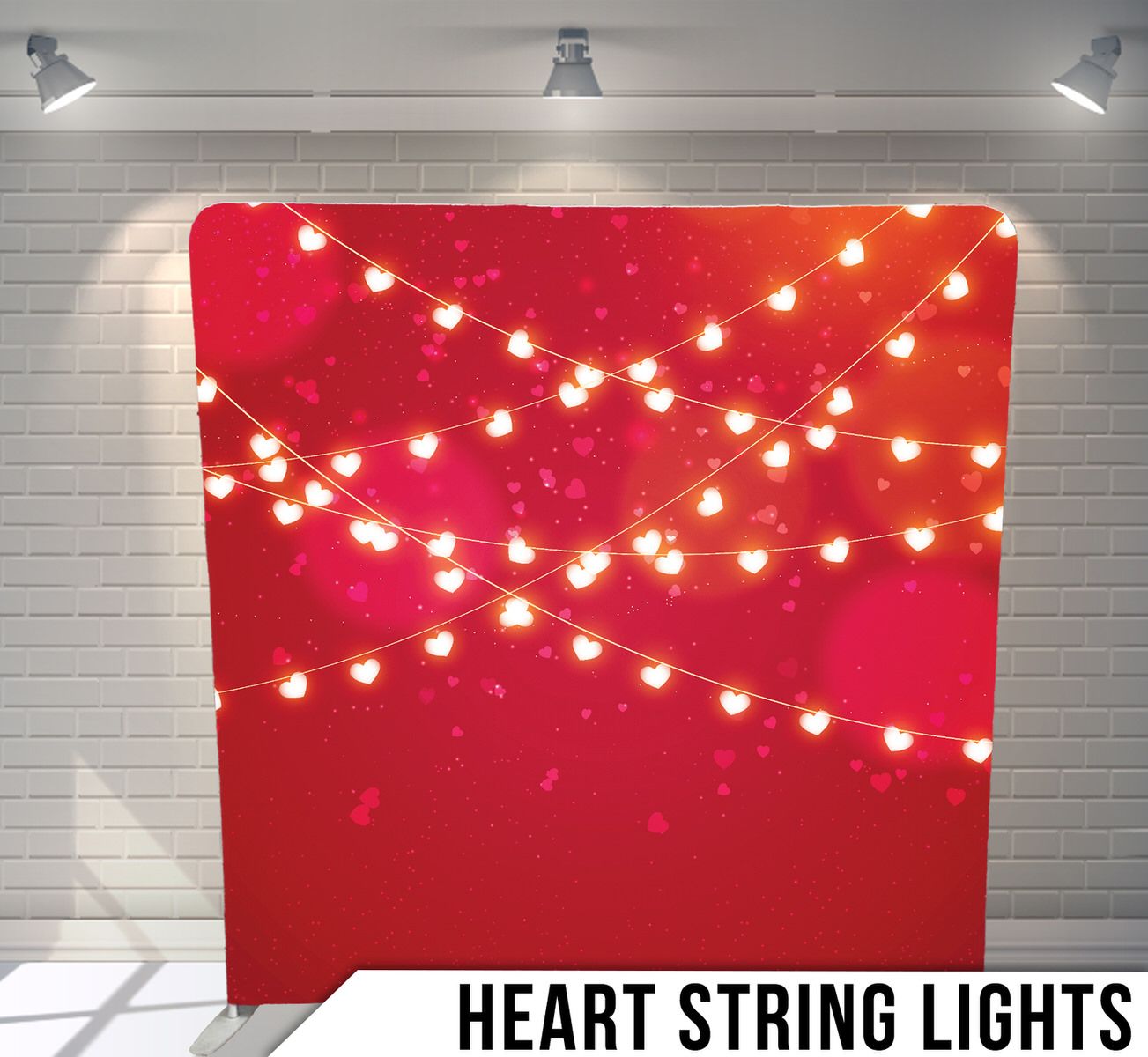 Heart-shaped string lights glowing against a red background with sparkles.