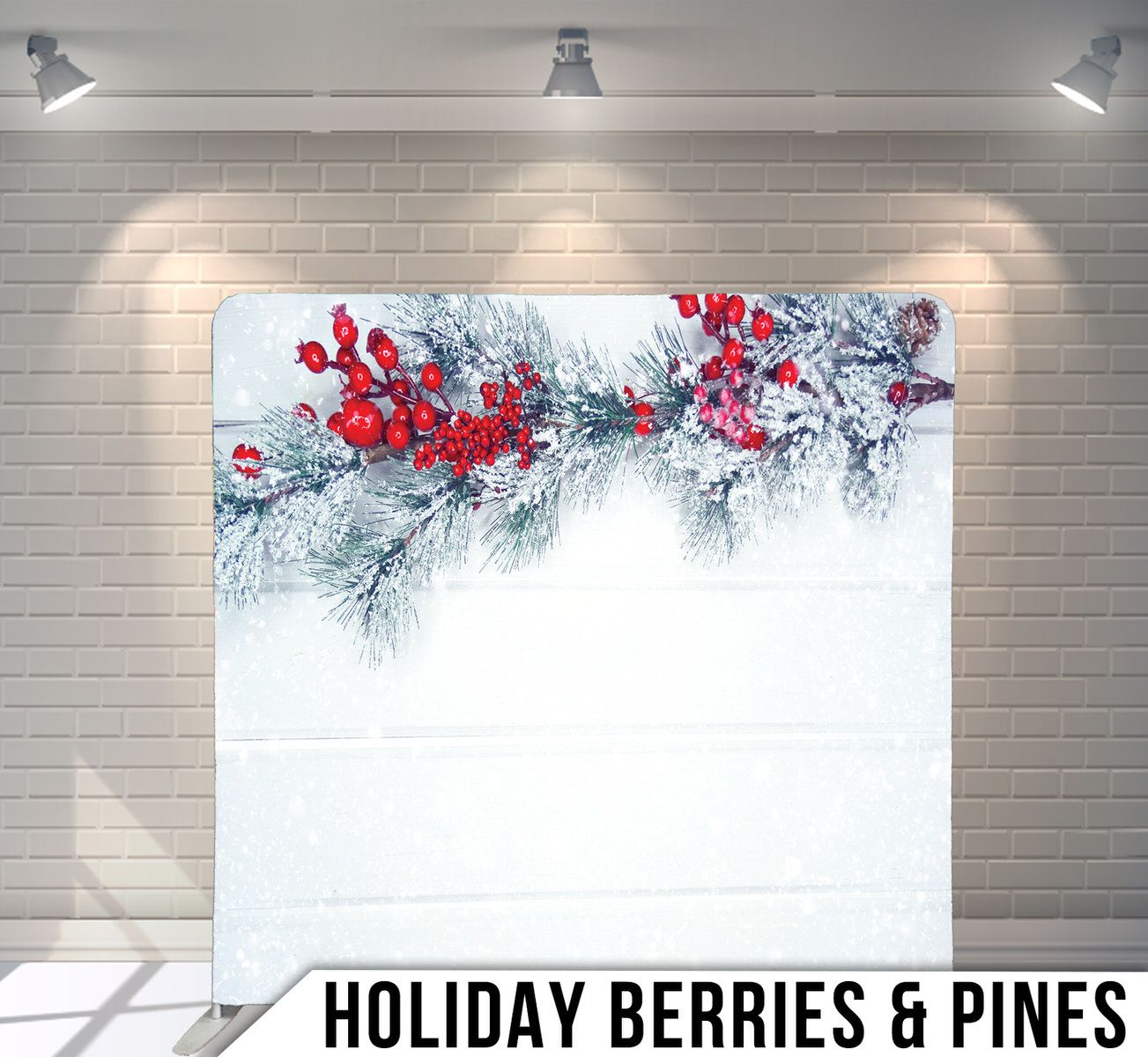 Festive winter scene with red berries and snow covered pine branches against white background.