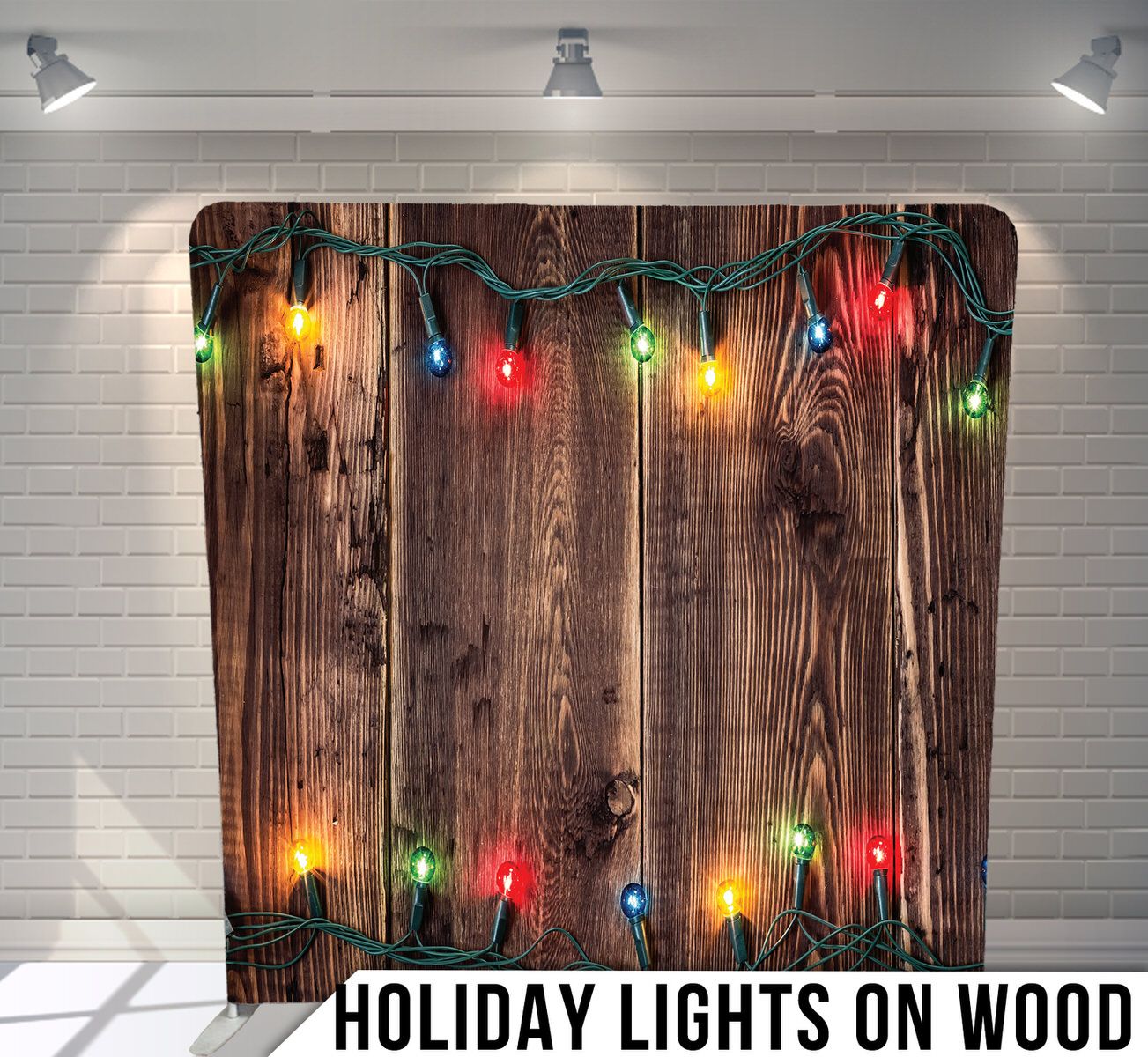 Rustic wooden background with colorful Christmas lights strung across the top.
