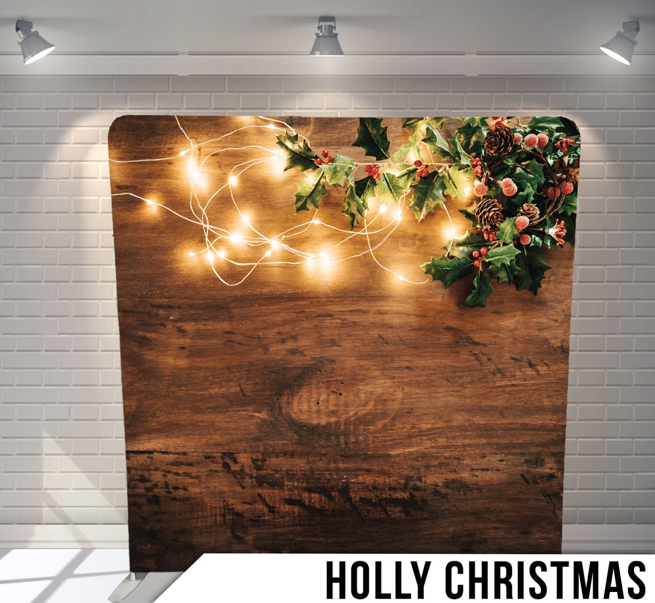 Warm string lights and holly leaves against dark wooden background creating festive holiday ambiance.