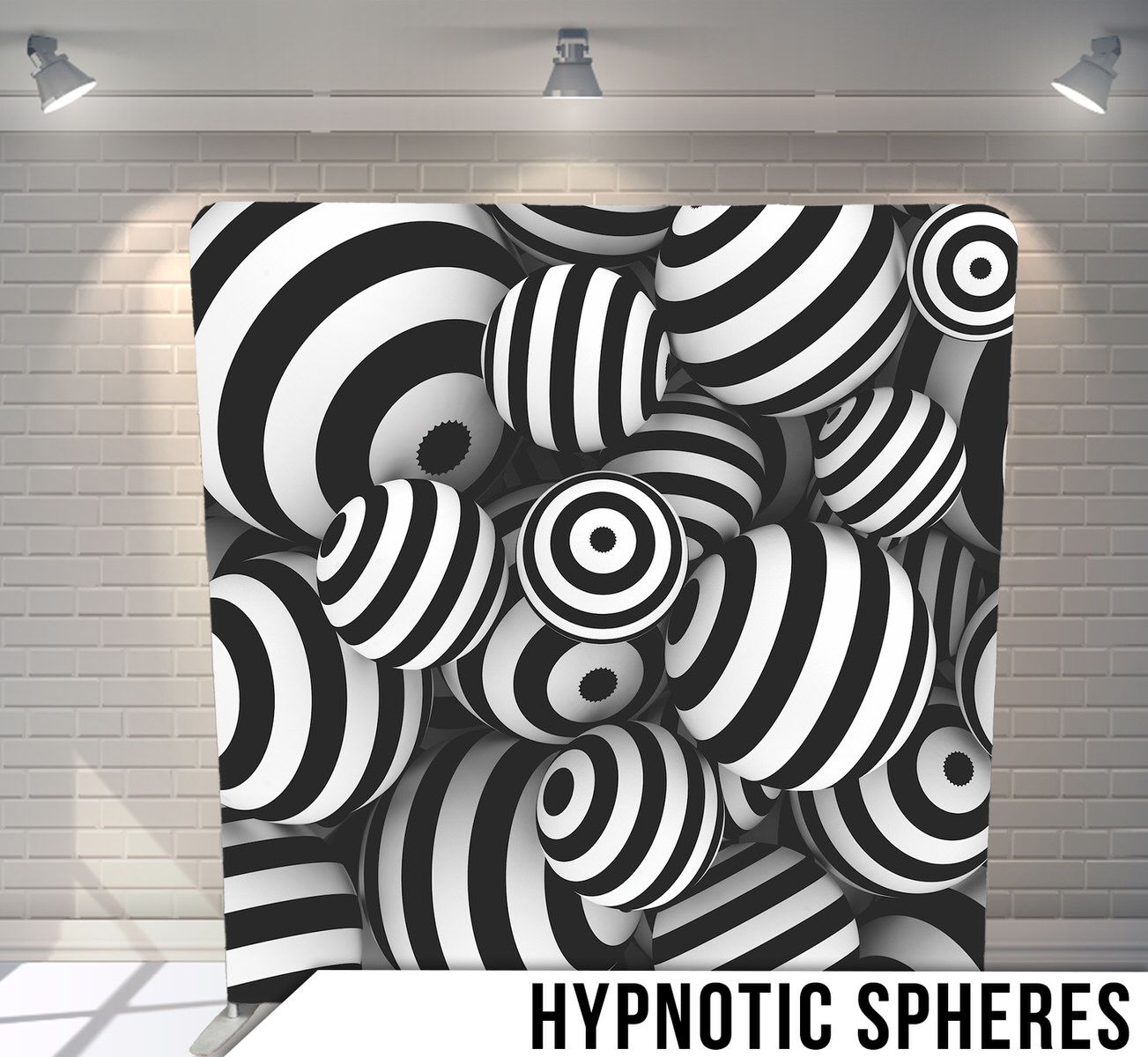 Abstract black and white pattern featuring hypnotic concentric circles and spherical shapes.