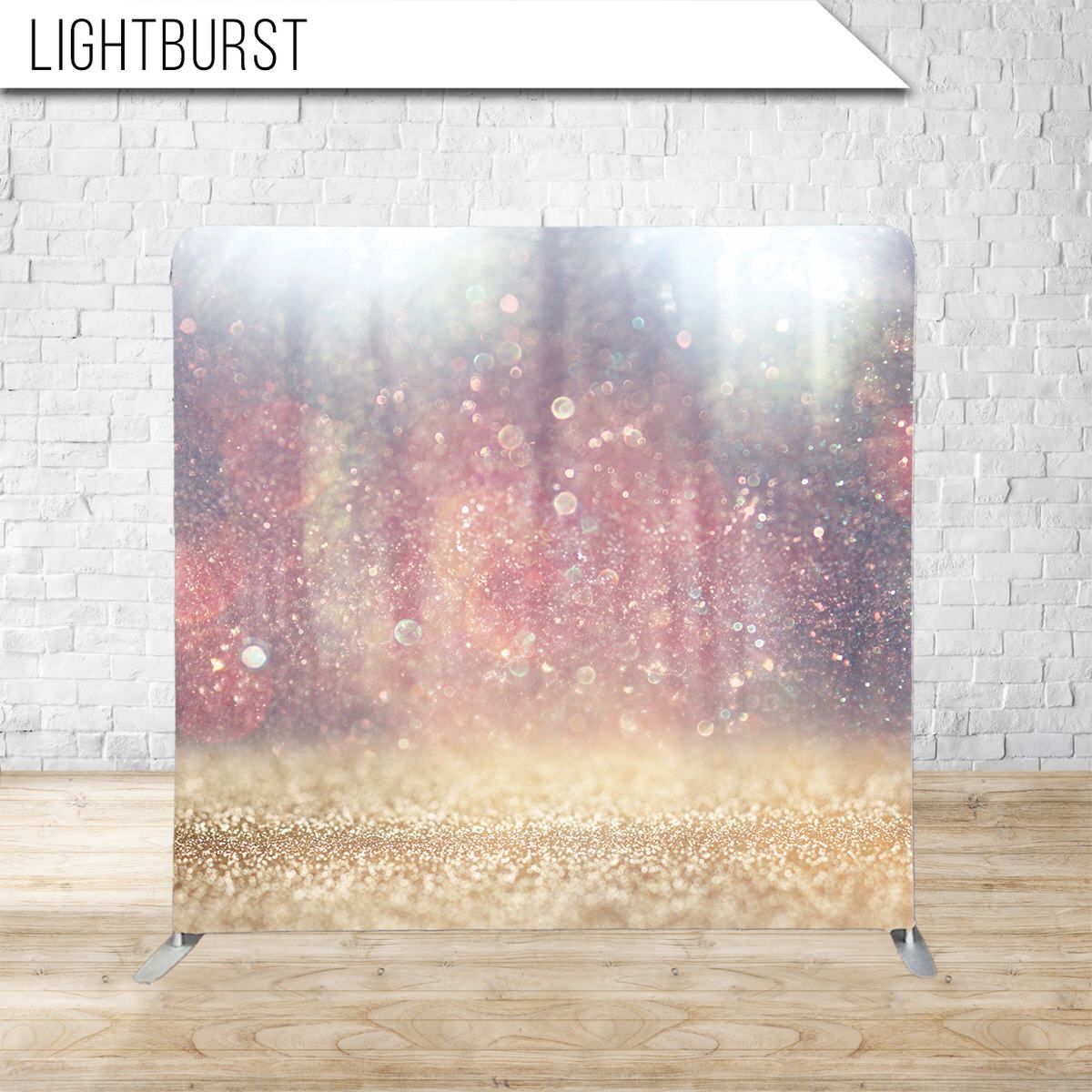 Magical lightburst backdrop with golden glitter and pink bokeh effects.