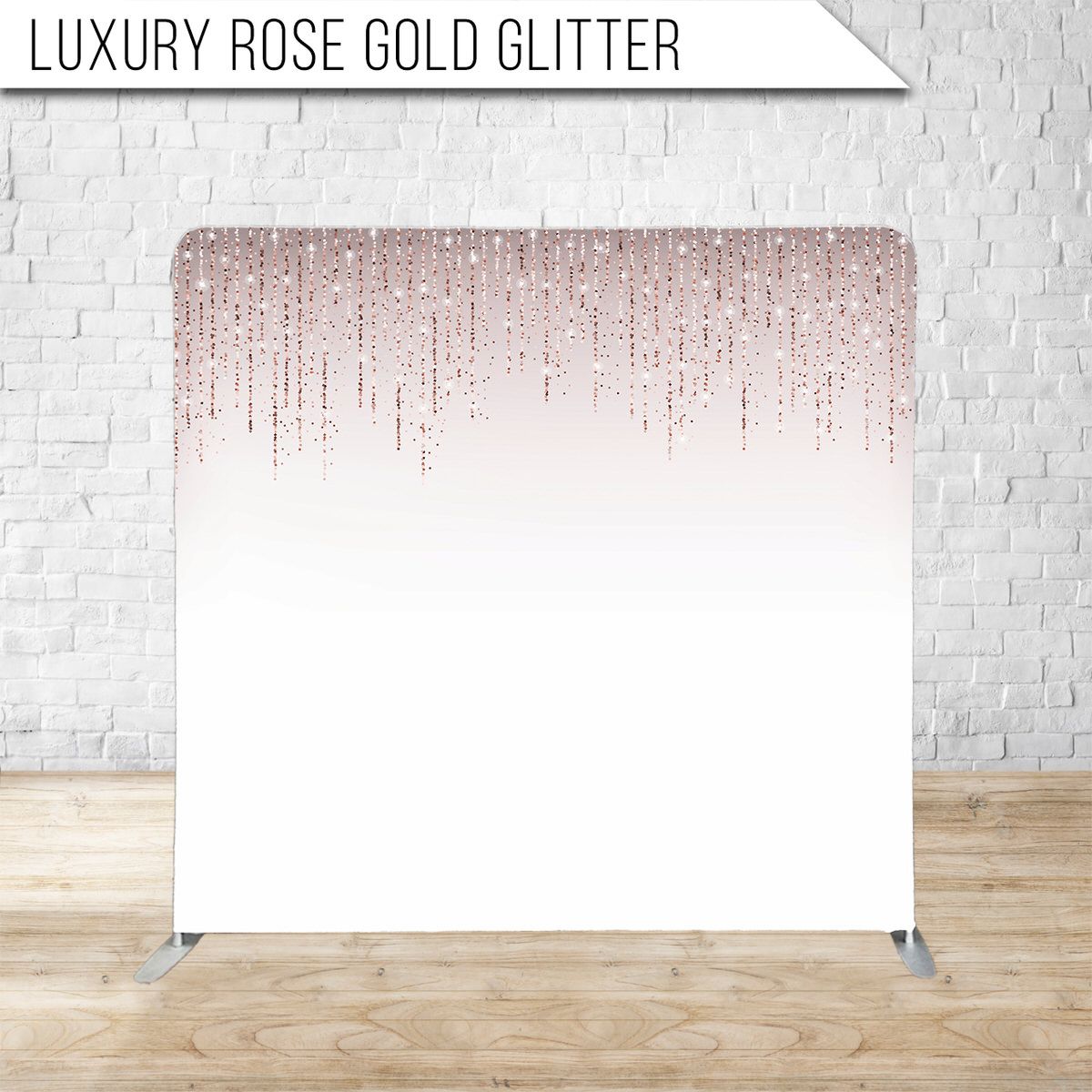 Rose gold glitter cascading down on white background creating an elegant ombre effect.