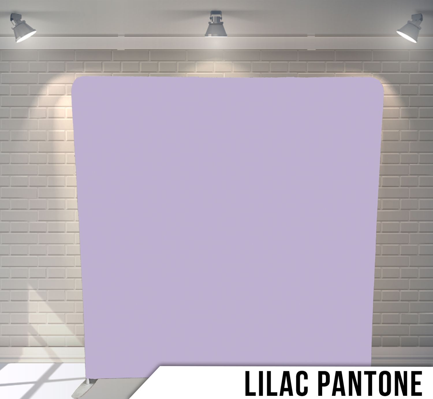 Solid lilac colored backdrop with studio lighting against white brick wall background.