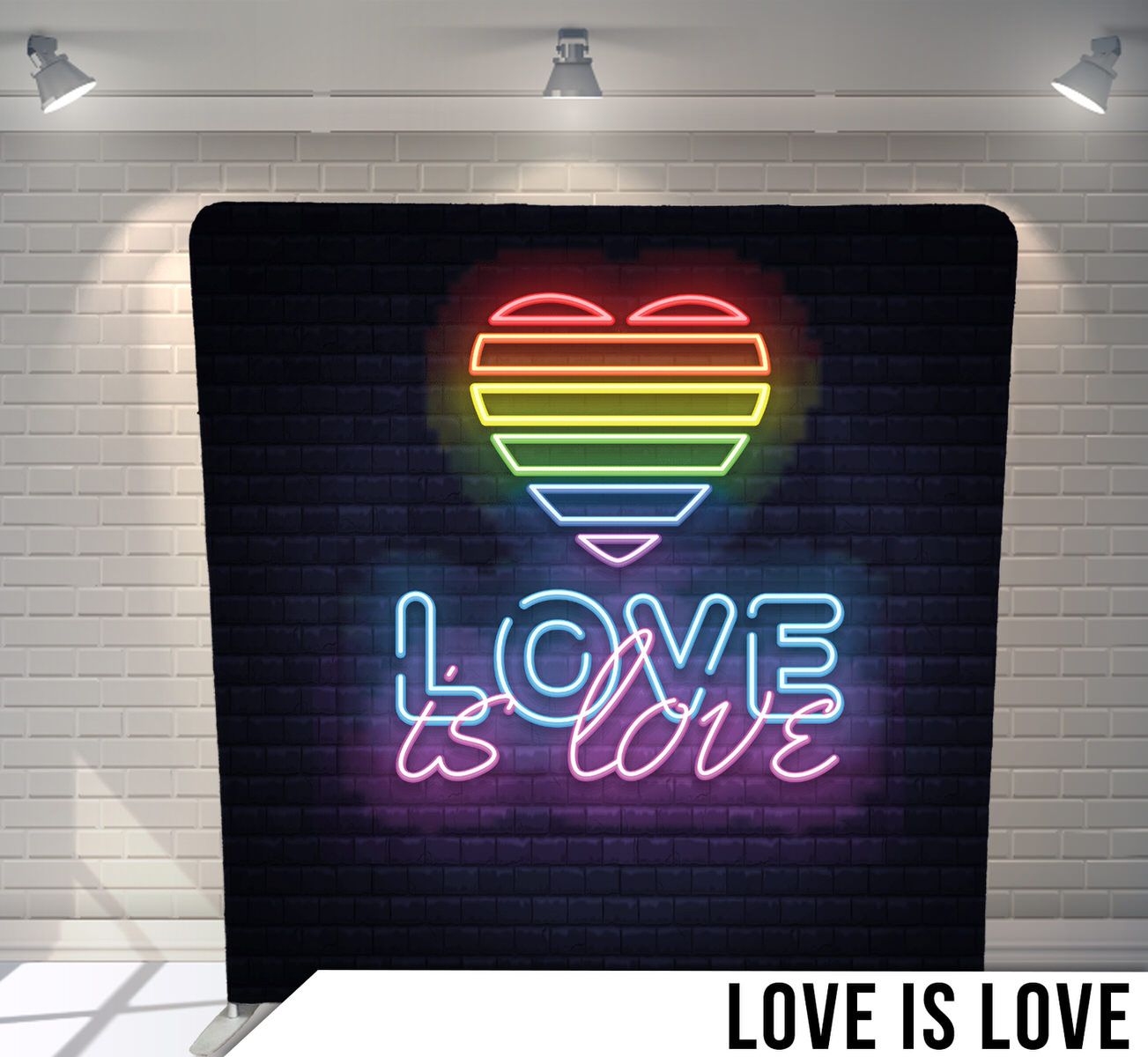 Rainbow neon heart with 'Love is Love' text glowing against dark brick wall.