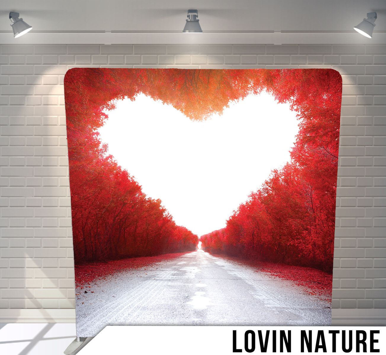 White heart-shaped clearing in red forest with path leading through center.
