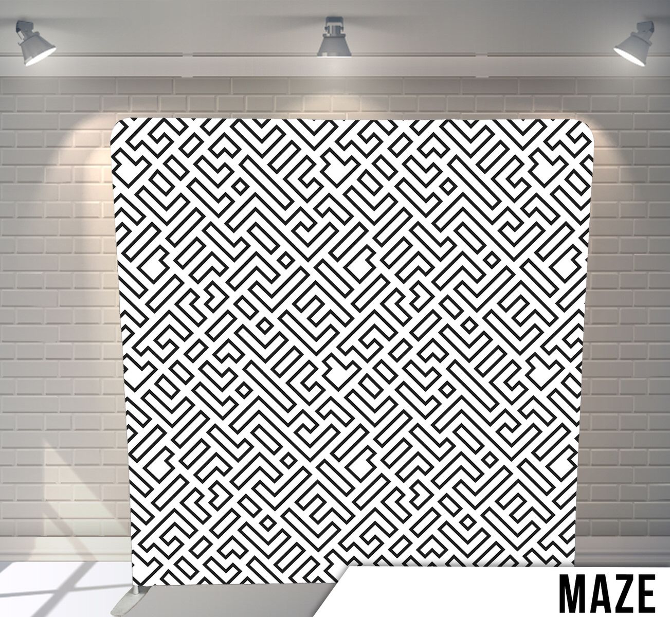 Black and white geometric maze pattern creating an intricate repeating design.