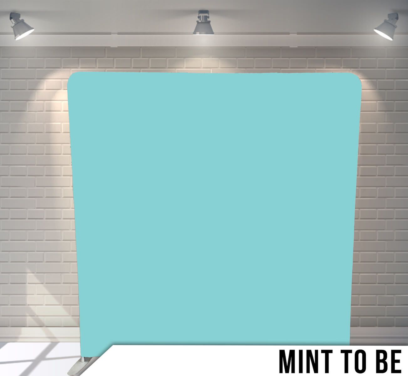 Solid mint blue colored backdrop with studio lighting on display.