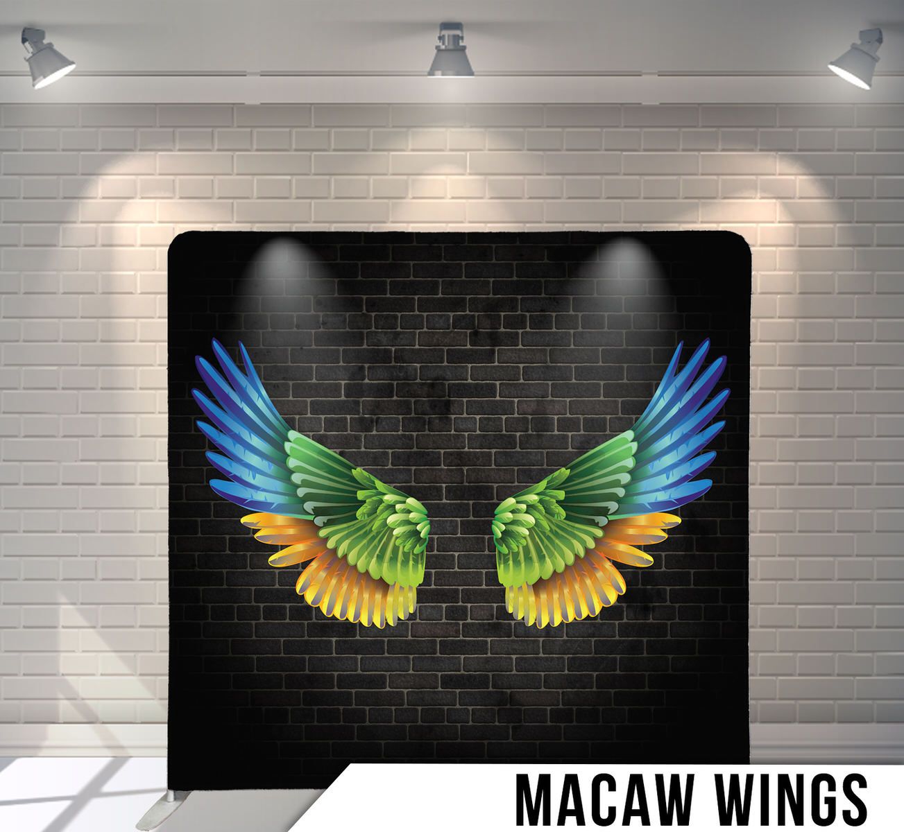 Colorful macaw wing design in vibrant blue, green and yellow against a dark brick wall background.