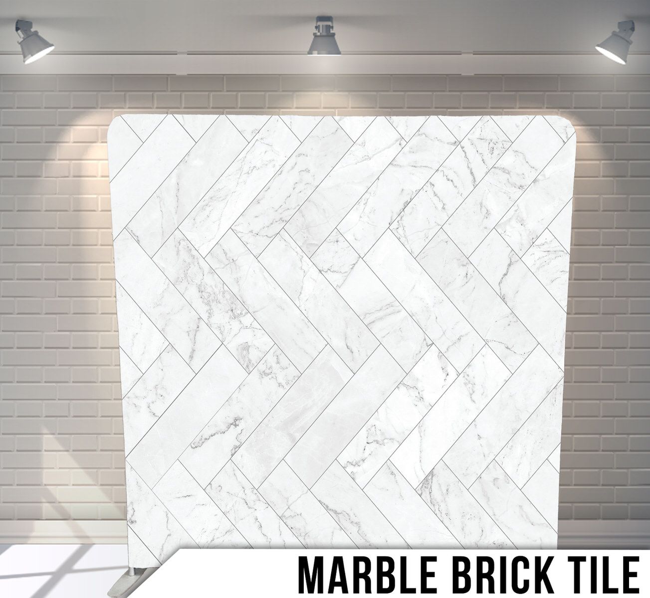 White marble tile pattern with geometric herringbone design and subtle gray veining.