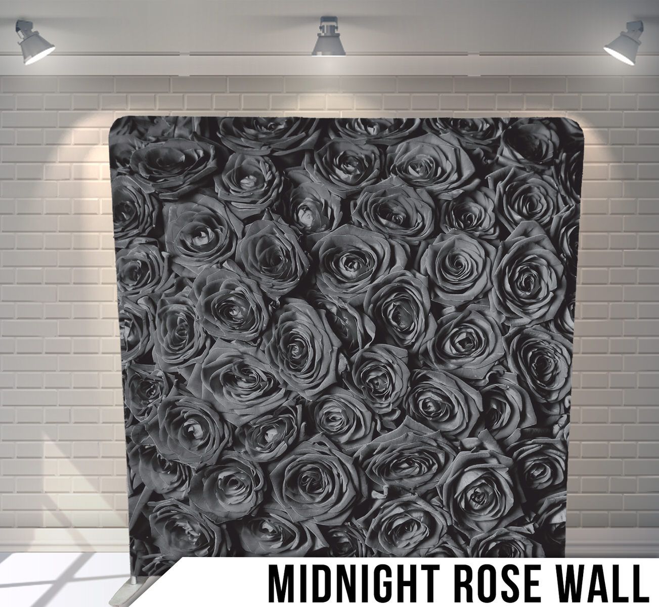Monochromatic pattern of black and grey roses creating dense floral wallpaper design.