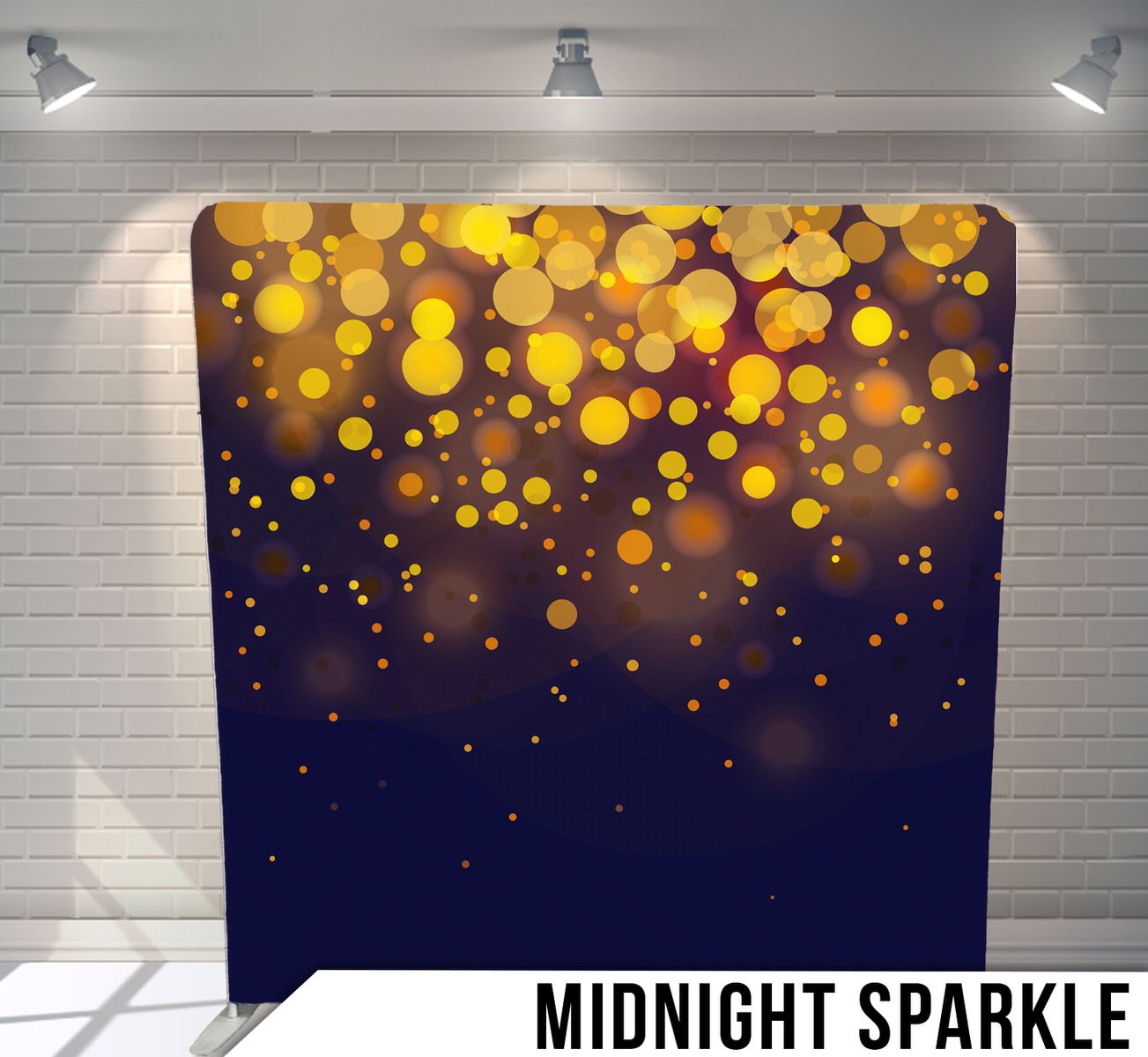 Shimmering golden bokeh lights fade into a dark blue background creating a magical midnight sparkle effect.