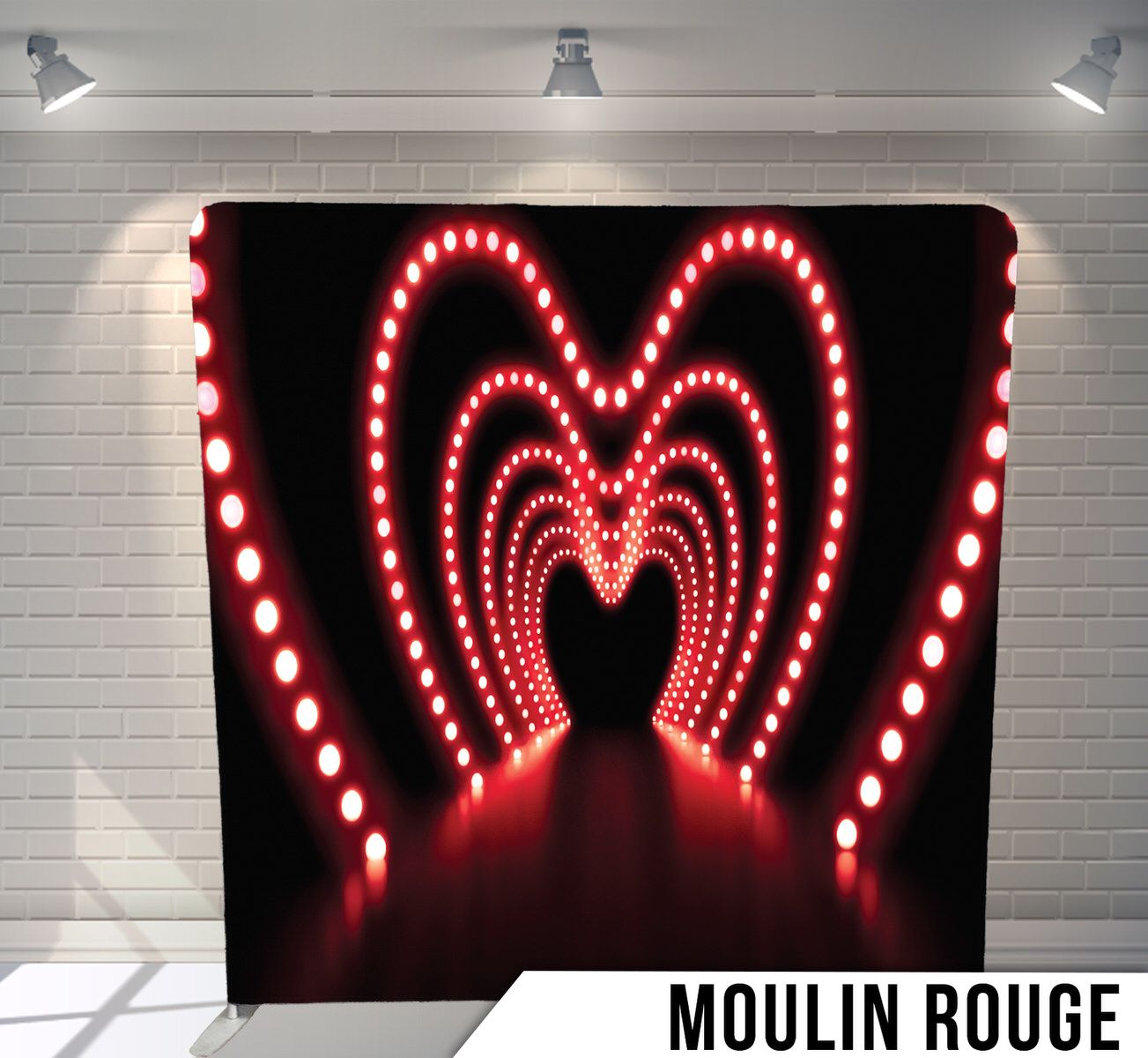 Illuminated red heart-shaped LED tunnel effect against a black background with Moulin Rouge text.