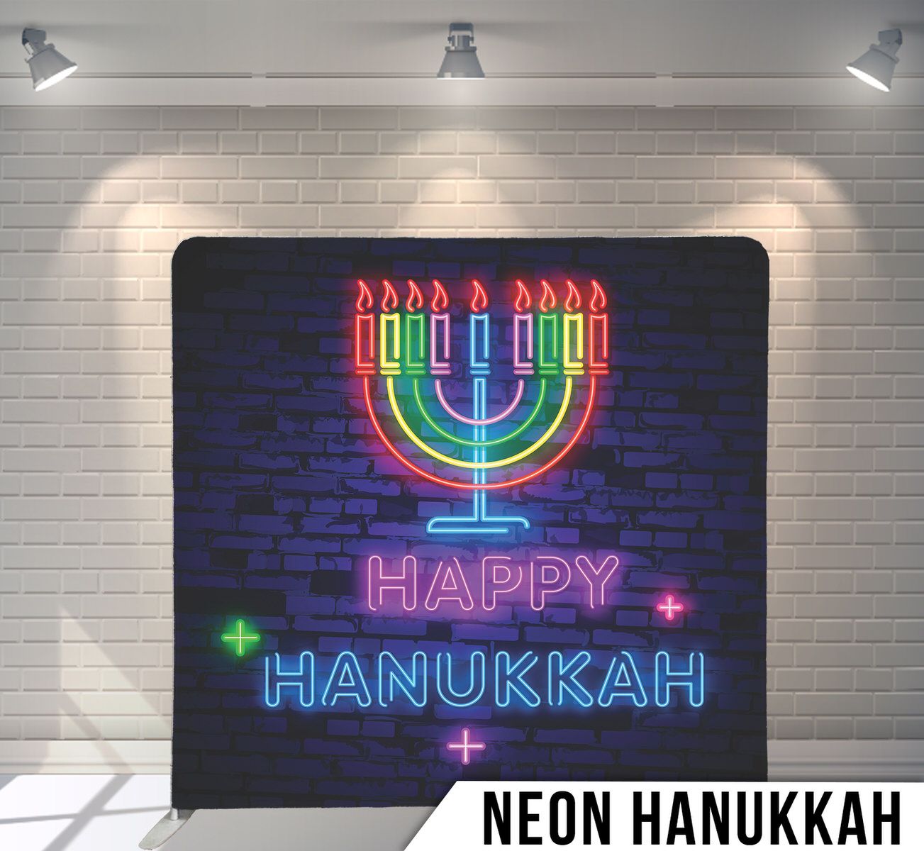 Neon menorah and Happy Hanukkah text glowing against dark blue brick wall background.