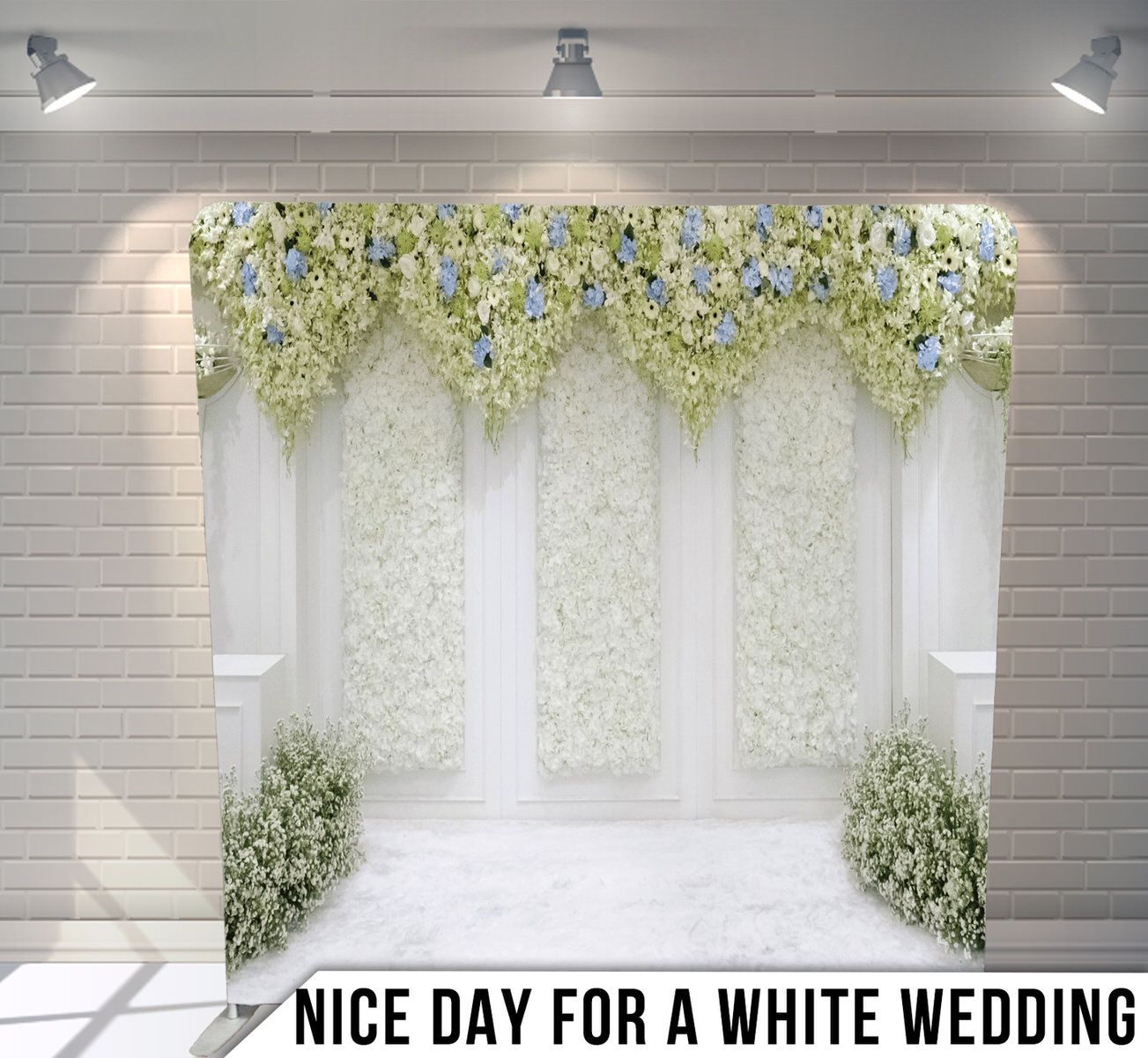 Elegant white wedding backdrop with floral archway and cascading yellow and white flowers.