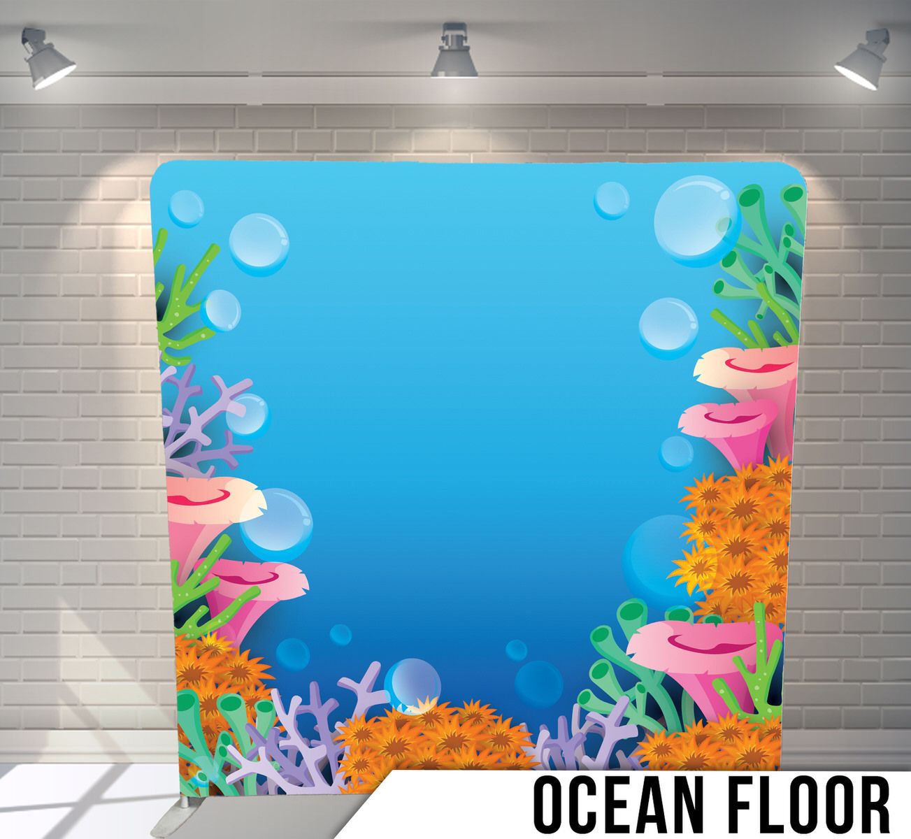 Underwater scene backdrop with colorful coral, bubbles, and sea plants against blue water.
