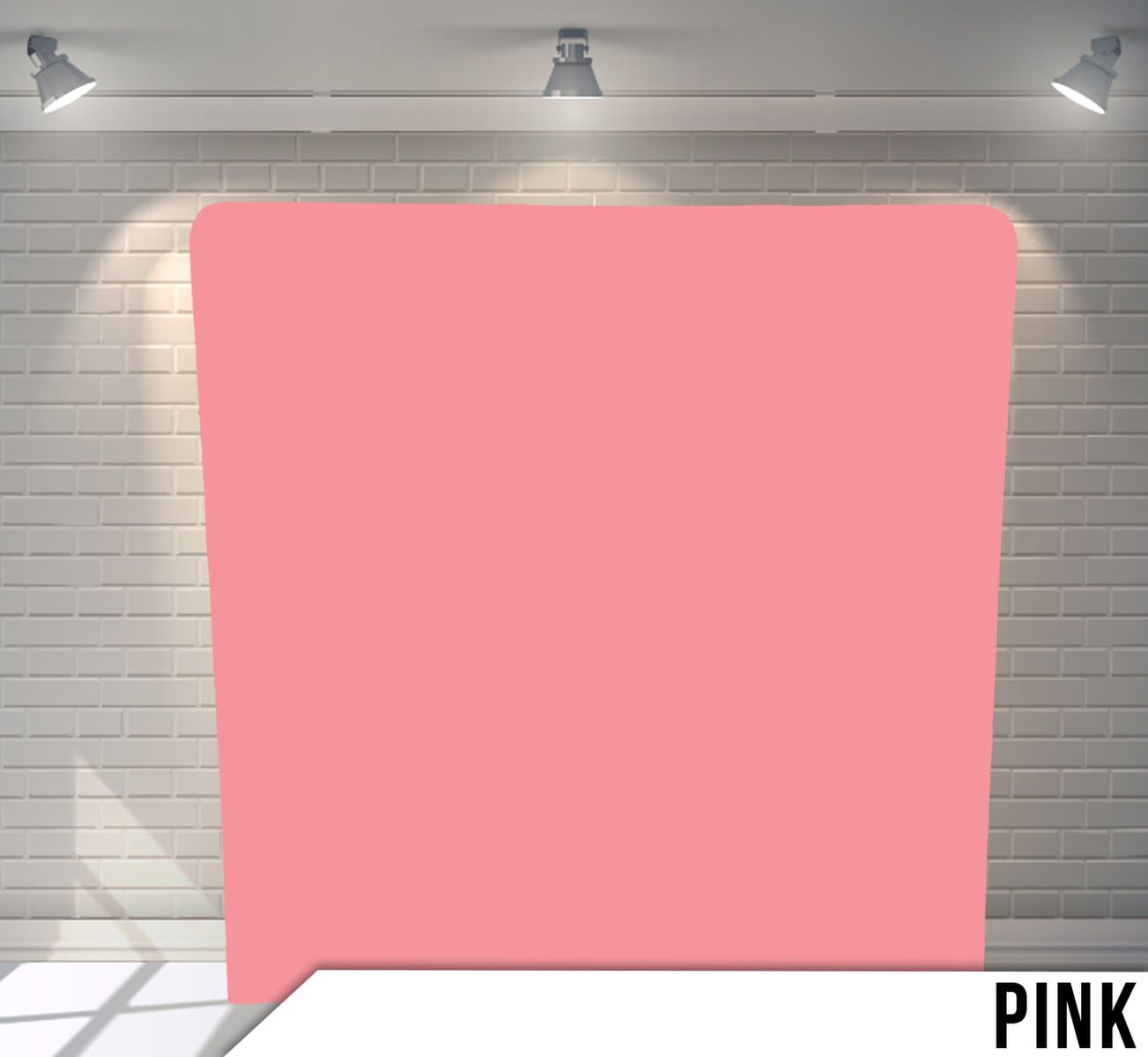 Solid pink photography backdrop with studio lighting.