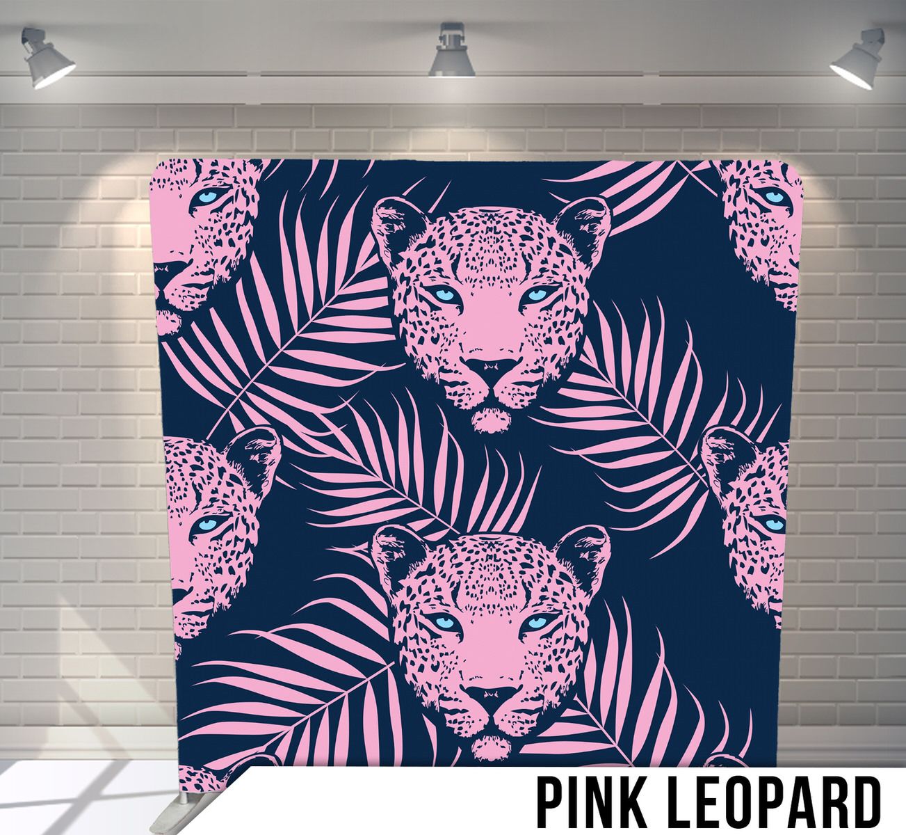 Seamless pattern with pink leopard faces and palm leaves on navy blue background.