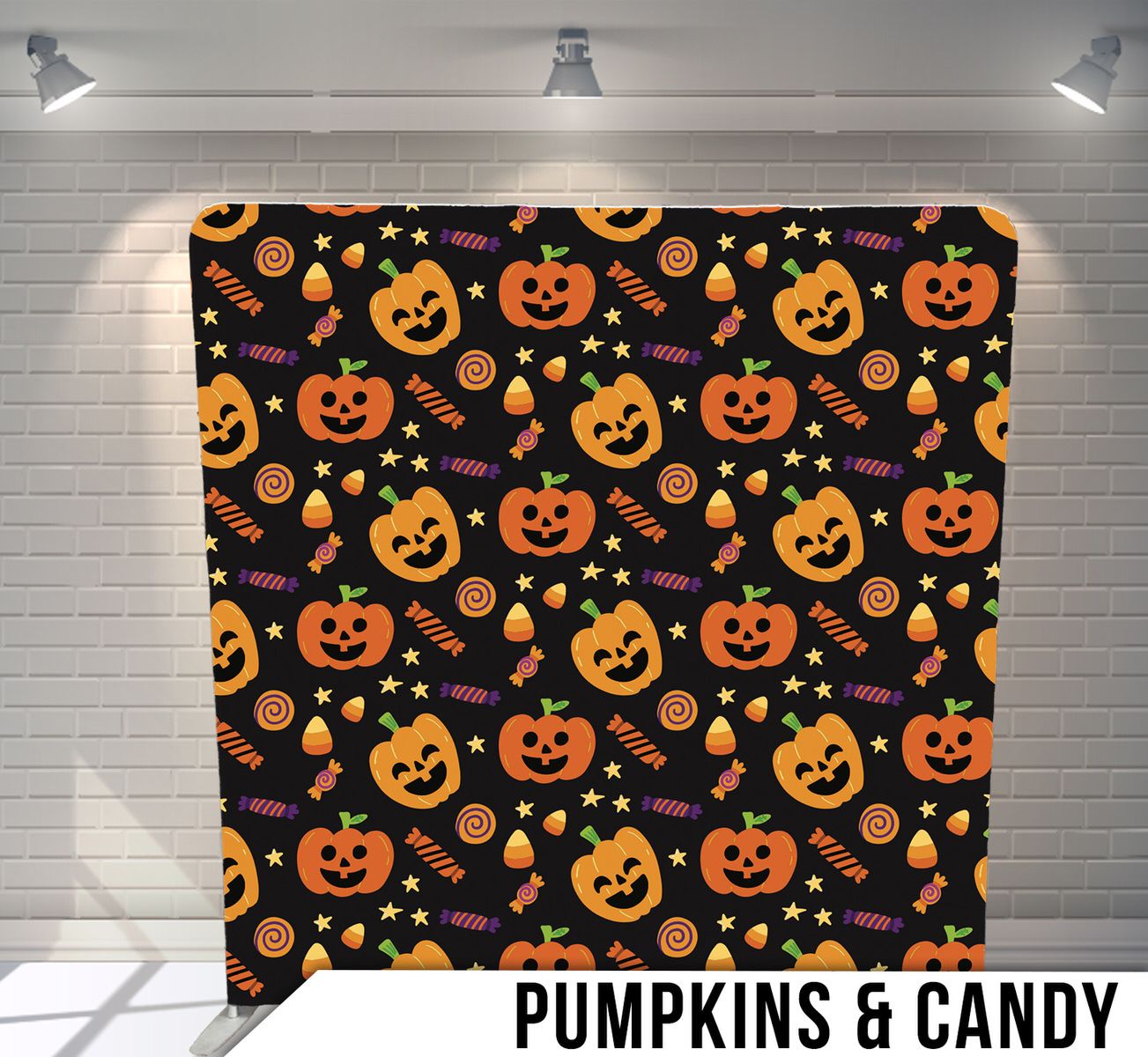 Seamless Halloween pattern with smiling pumpkins and candy on a black background.