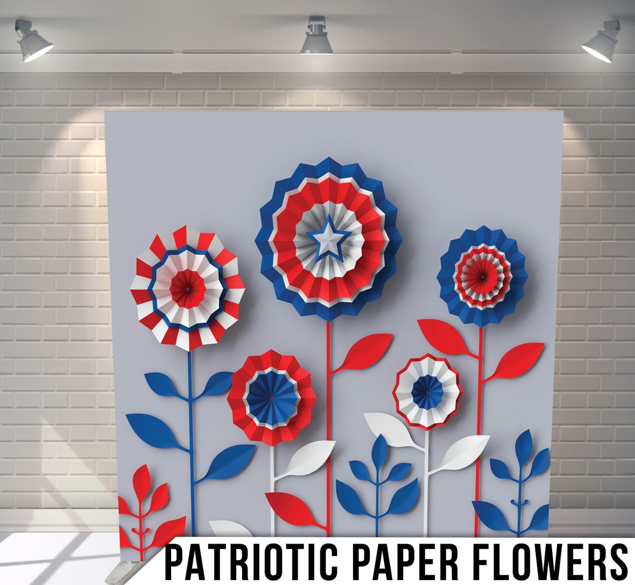 Decorative paper flowers in red, white and blue with leaf accents arranged on light gray background.
