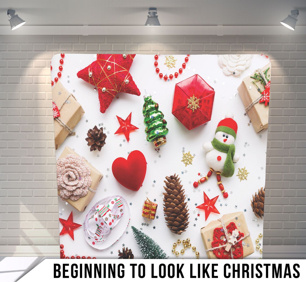 Festive Christmas decorations including ornaments, pinecones, snowman and stars arranged on white background.