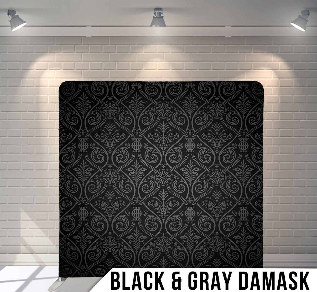 Black damask pattern backdrop with intricate swirling designs in dark gray tones.