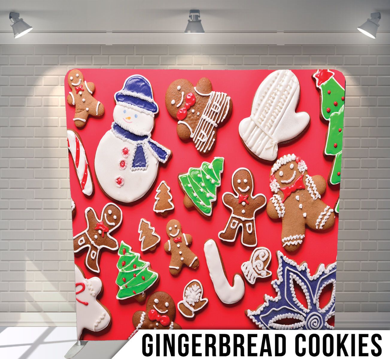 Christmas themed gingerbread cookies and decorations arranged on red background.