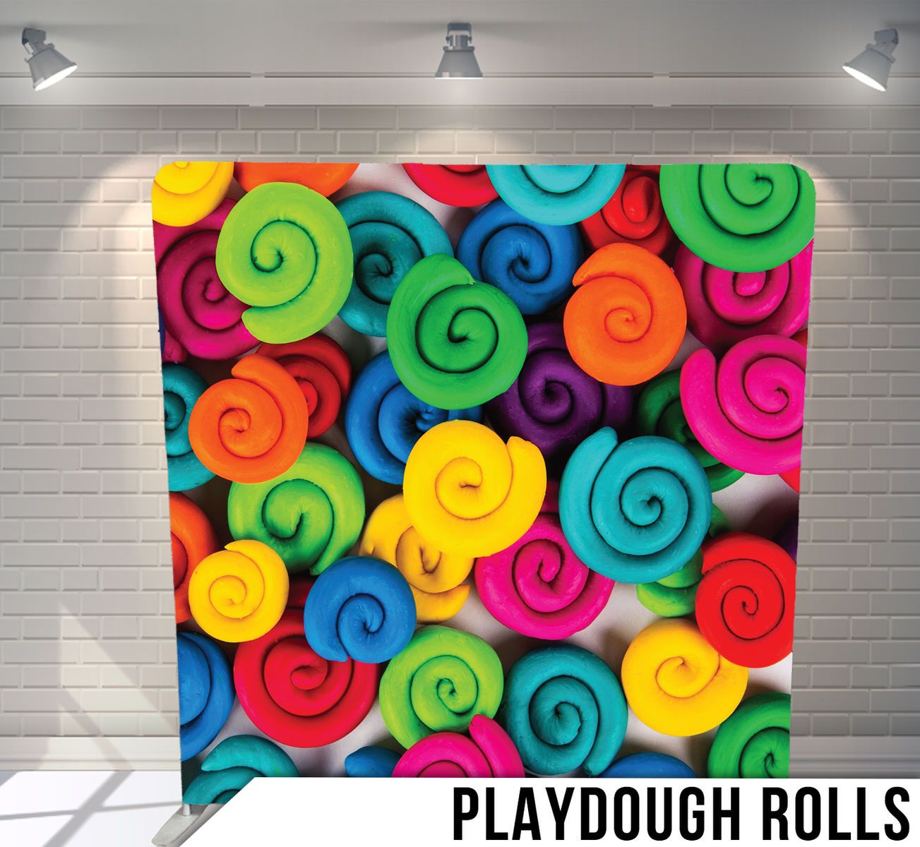 Colorful spiral patterns in rainbow colors resembling rolled playdough or clay shapes.