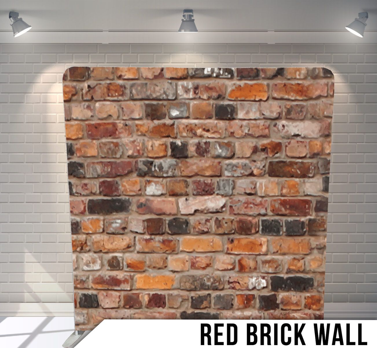 Weathered red brick wall texture with rustic mortar joints illuminated by overhead spotlights.