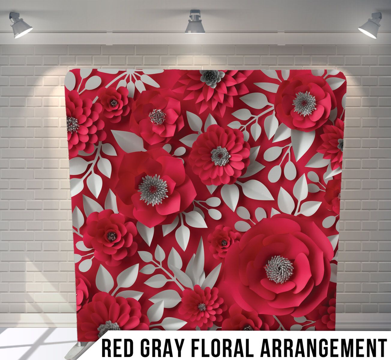 Bold red and white paper flower wall backdrop with layered floral designs.
