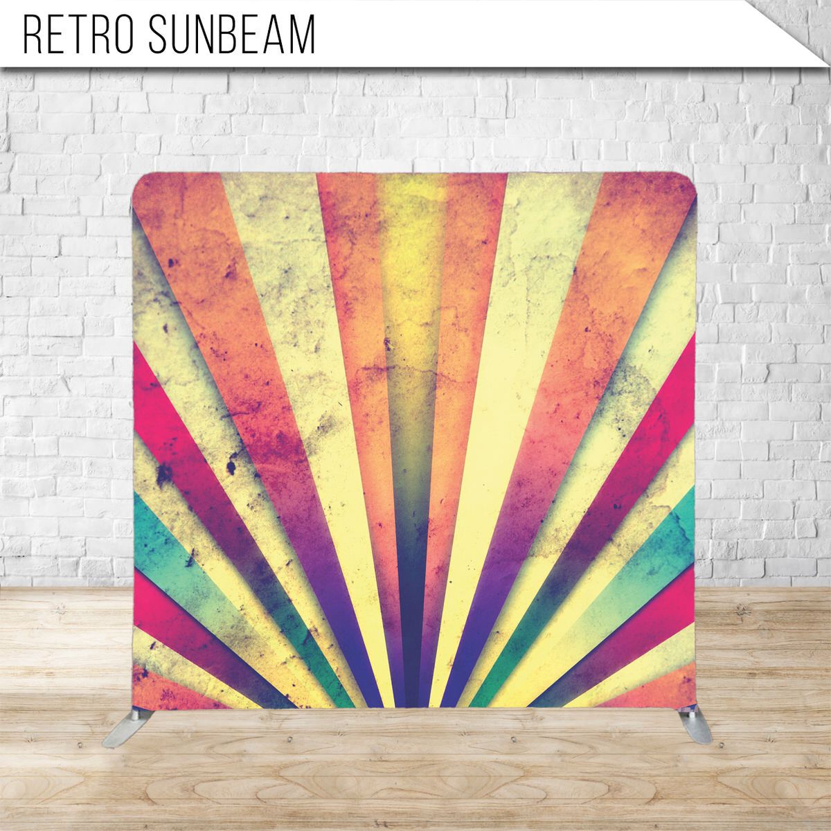 Vintage sunburst pattern in rainbow colors with distressed texture effect.